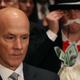 Former Equifax CEO Richard Smith flanked by a protester at a Senate hearing. Photo: Getty Images